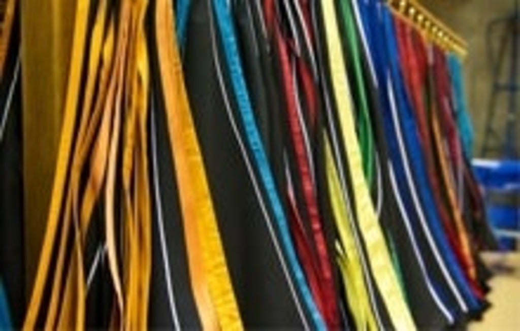 Multicoloured hoods awaiting graduates at convocation.