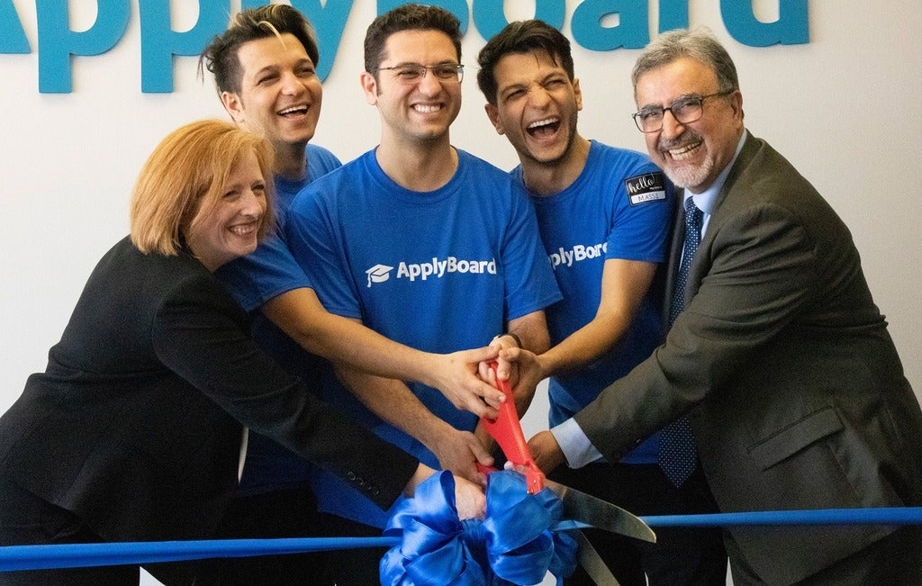 Feridun cutting the ribbon at ApplyBoard