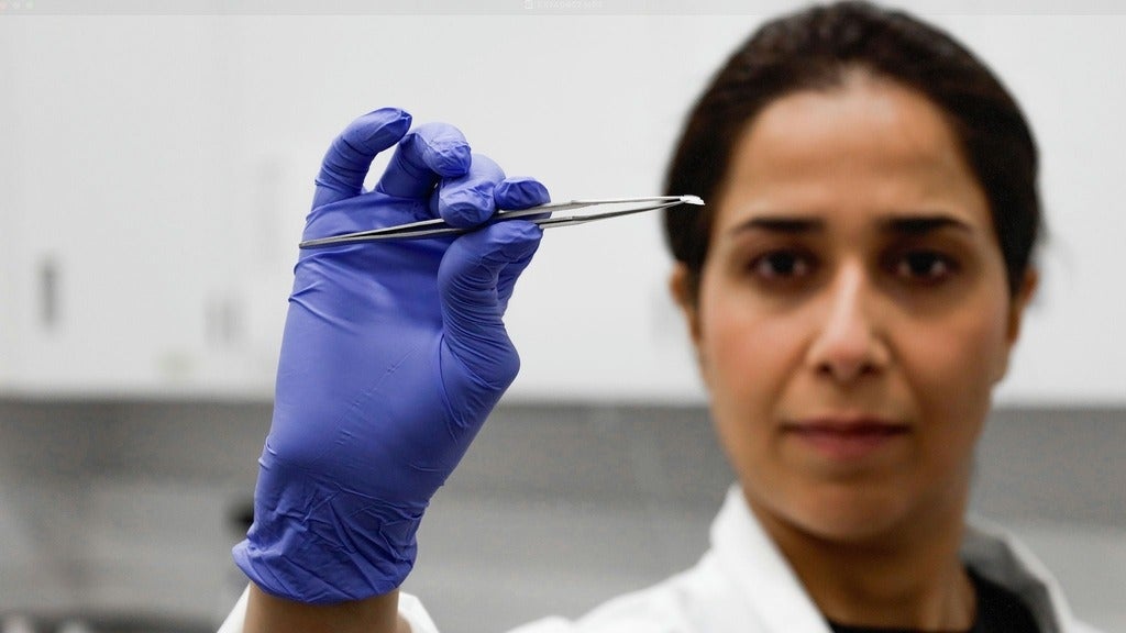Person hold mini patch with a tweezer