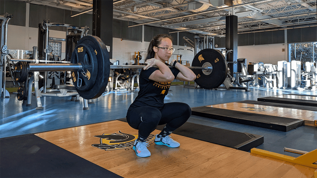 Evelyn Jiang lifts heavy weights in gym