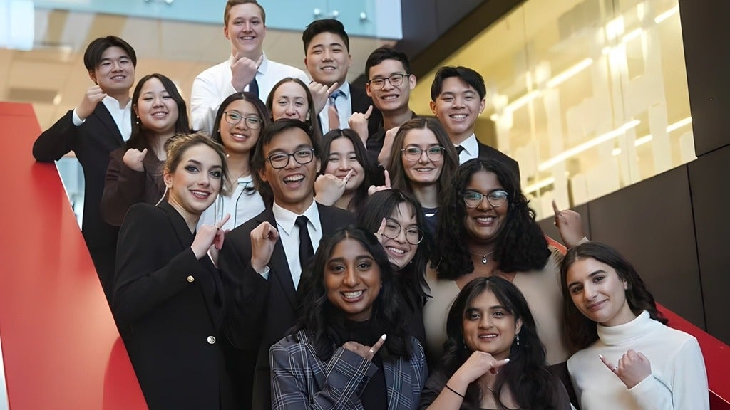  Faculty of Engineering graduating students showing their iron ring on the steps of Engineering 7 building