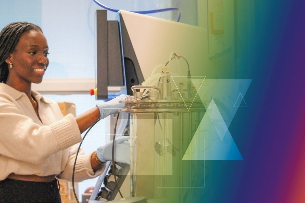 Eugenia Dadzie operating a lab machine for MetaCycler BioInnovations