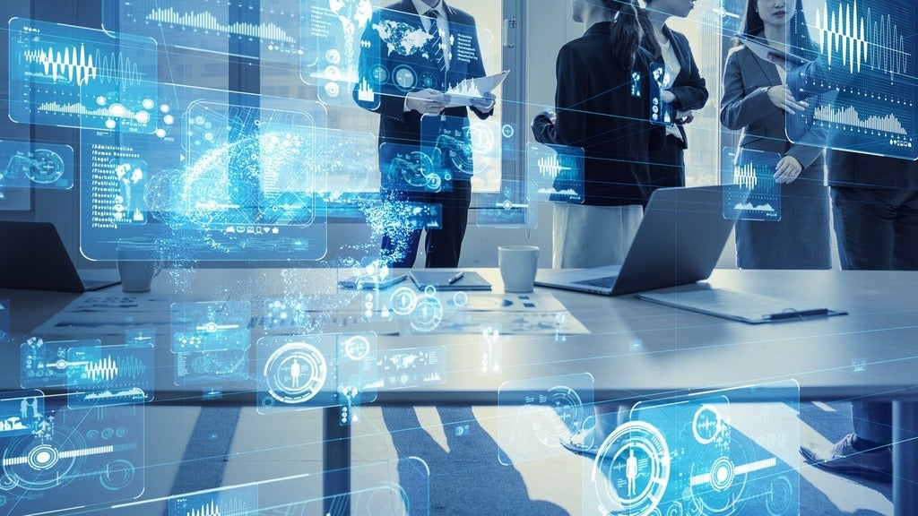 AI codes appear on the foreground while business workers are in the background