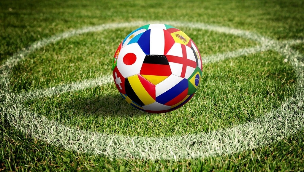 Soccer ball on green playground