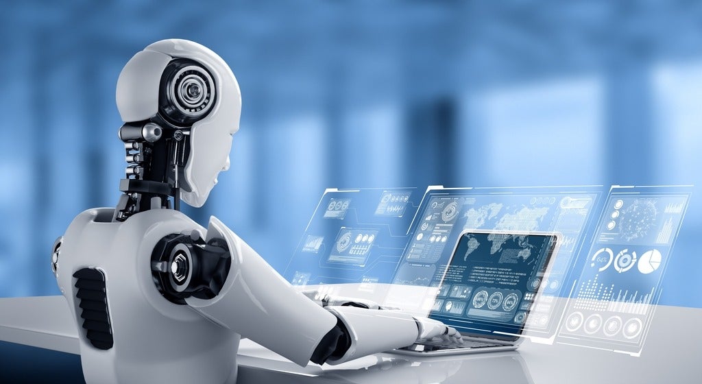 Robot working on a computer