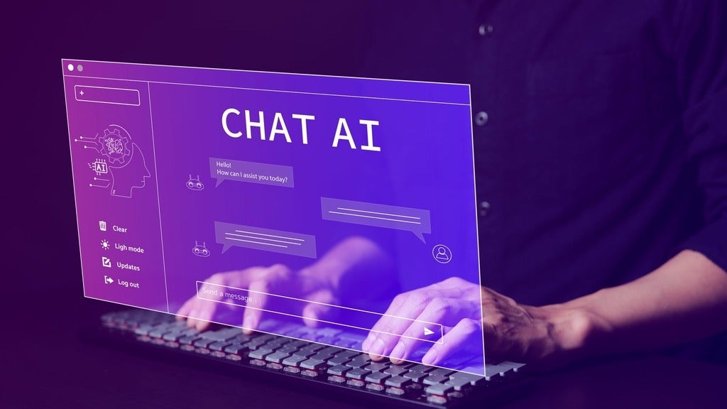 Person using a laptop computer chatting with AI technology