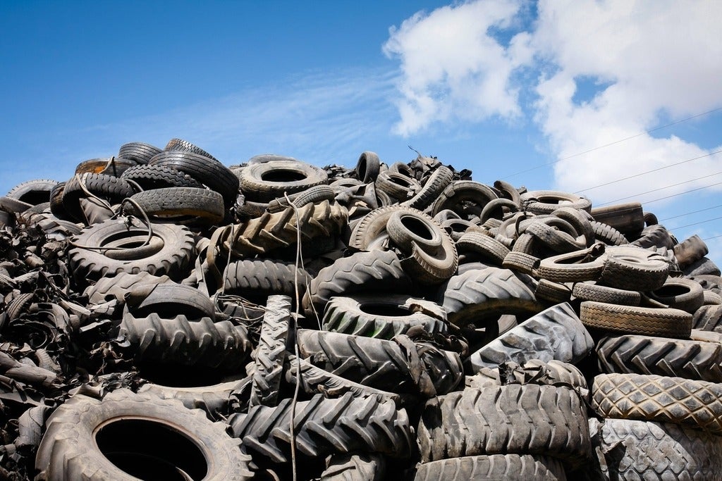 A pile or rubber tires in a landfill