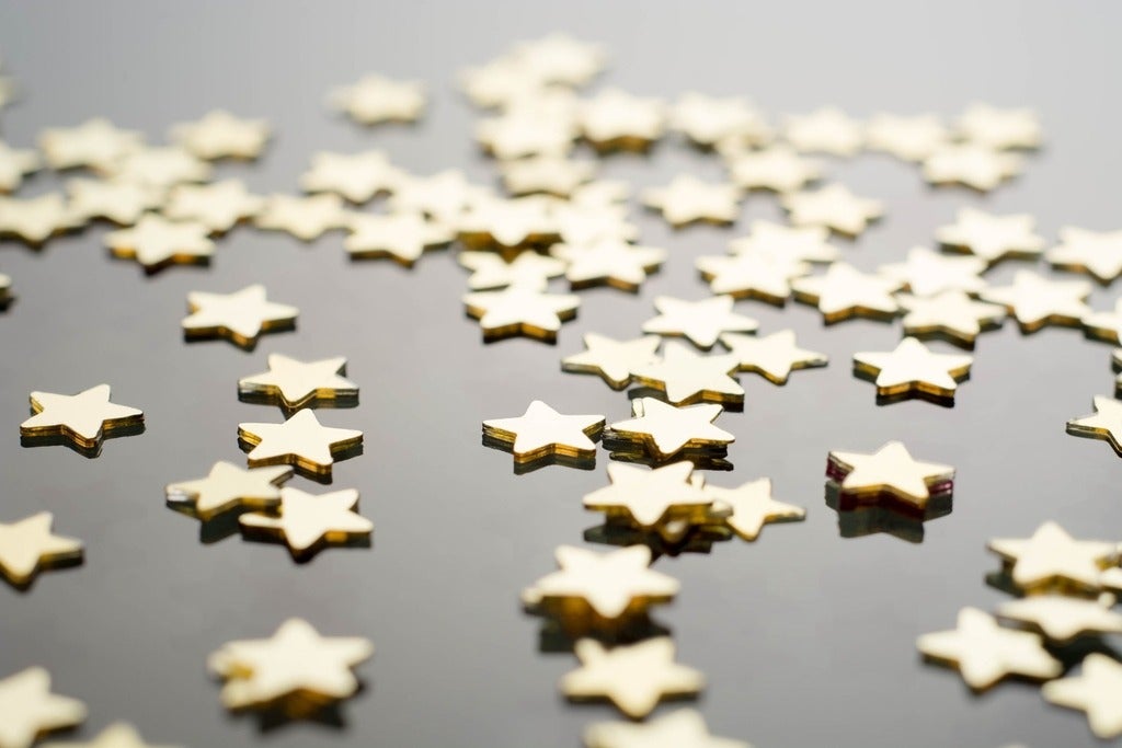 golden stars against grey background