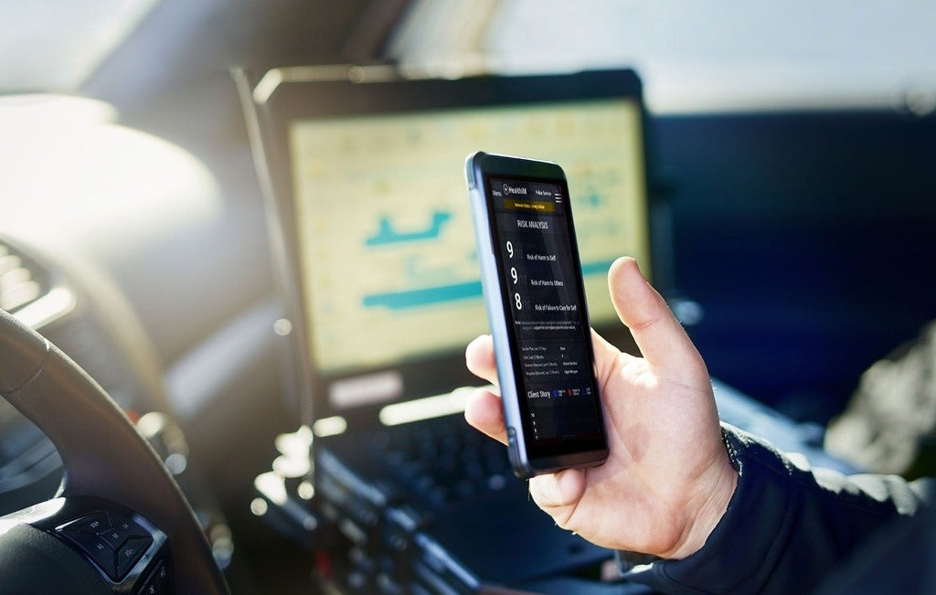 Police officer using smart phone app
