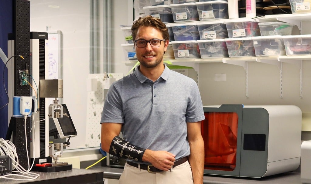 Nicholas Levinski wearing a prototype of the lymphedema sleeve