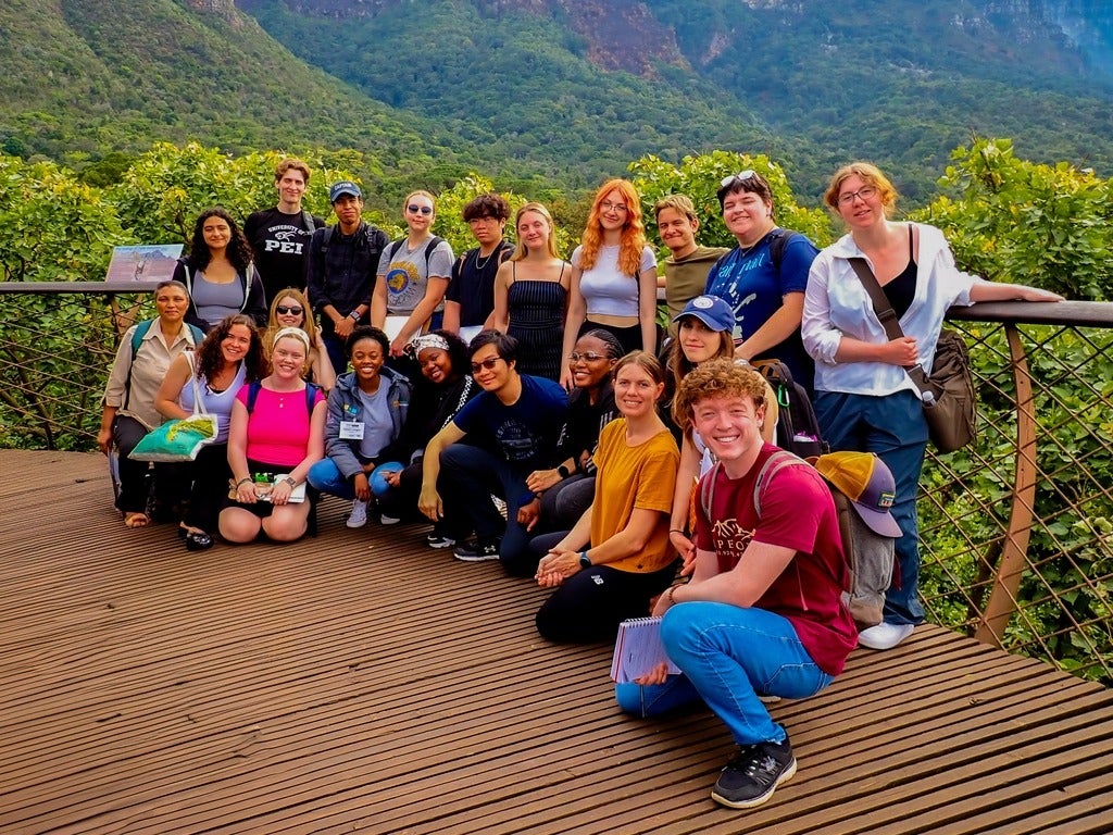 Indigenous students in a field study course in Cape Town, South Africa, posing for a group photo
