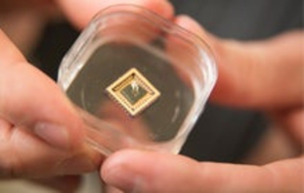 Jonathan Baugh holds a nanowire-based infrared detector