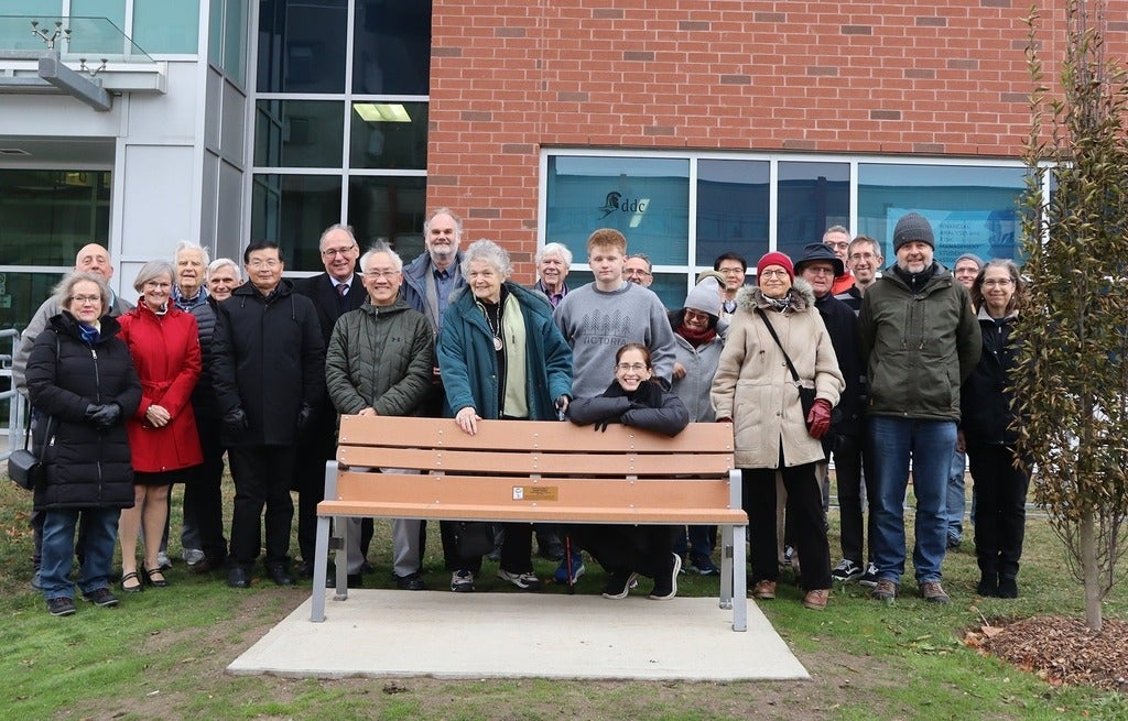 Family and friends of Professor Josef Paldus gather at unveiling of memorial bench and tree at the University of Waterloo. 