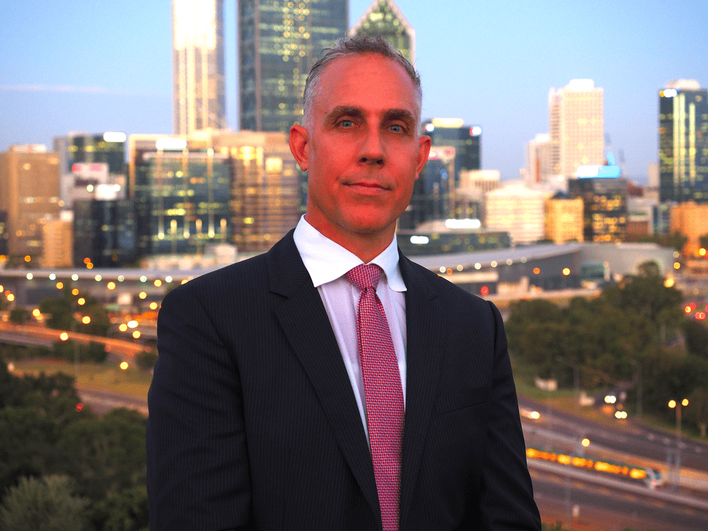 Leon Gerard Vandenberg in front of a city skyline
