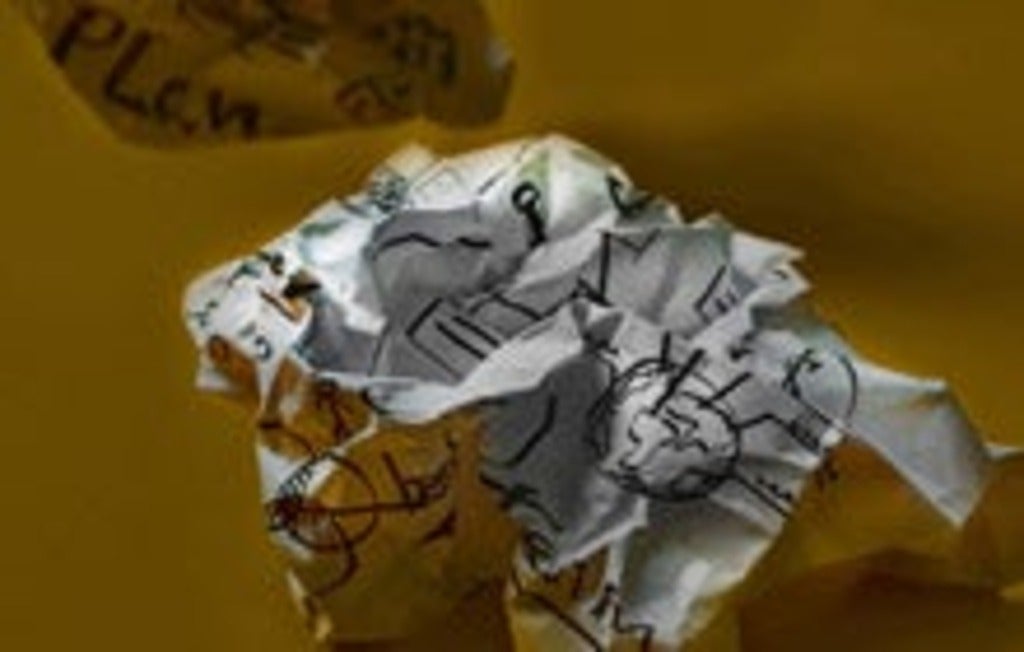 crumpled up paper with writing on it