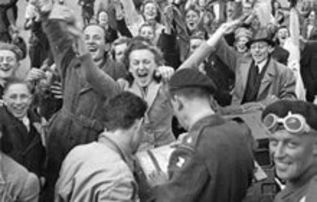 Dutch civilians and Canadian Army troops celebrating the Liberation