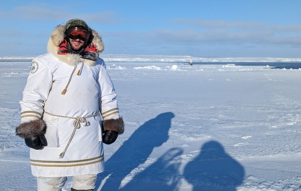 Man standing on ice pack in Nunavut 