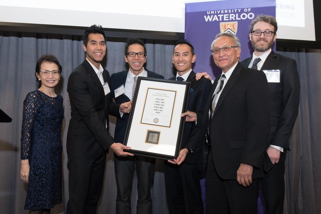 The Nulogy team accept their award with Dean Pearl Sullivan