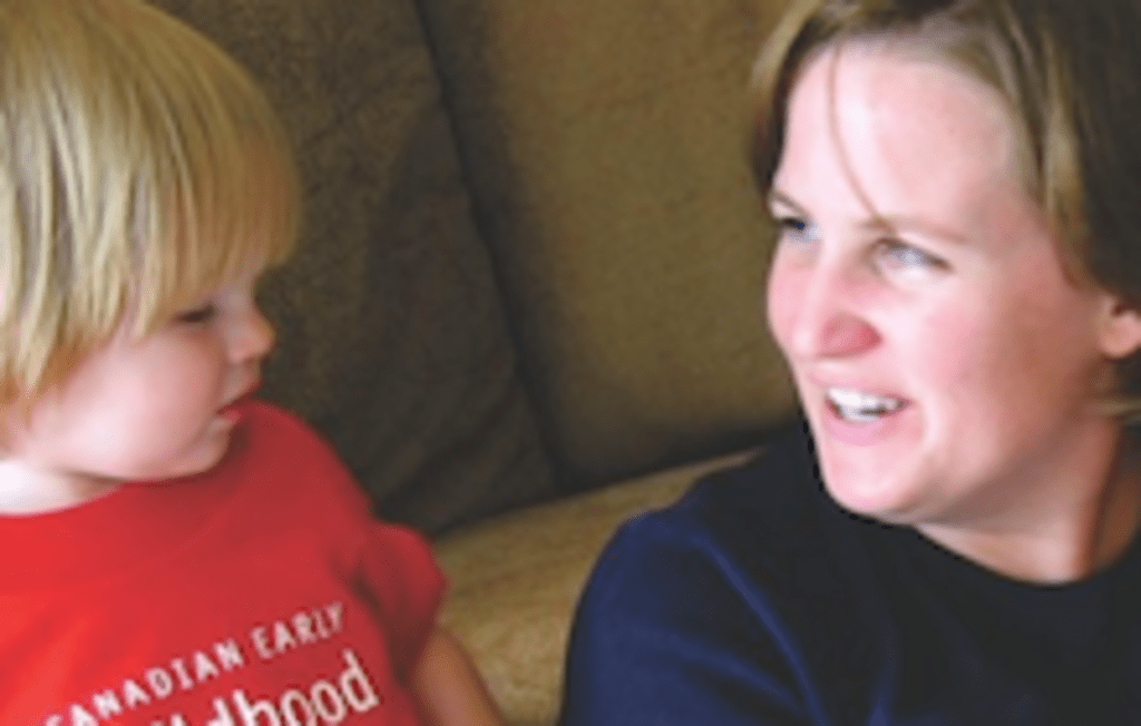 Woman speaking to a young child