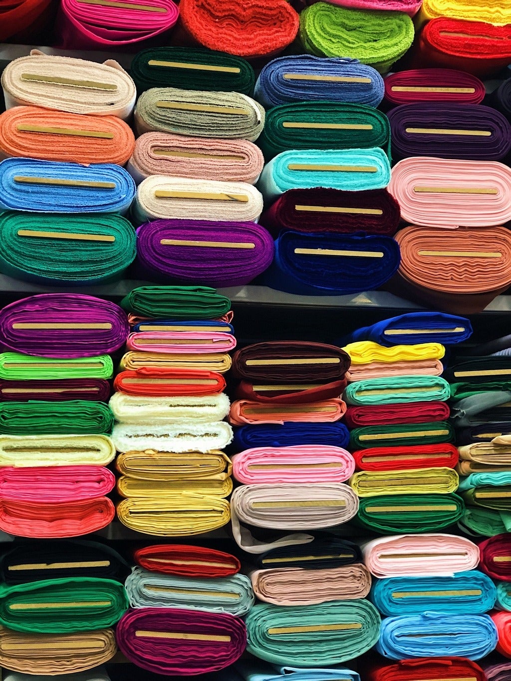Bolts of colourful fabric.