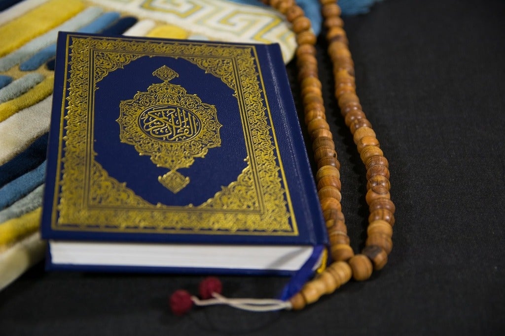Gold and blue book on black textile