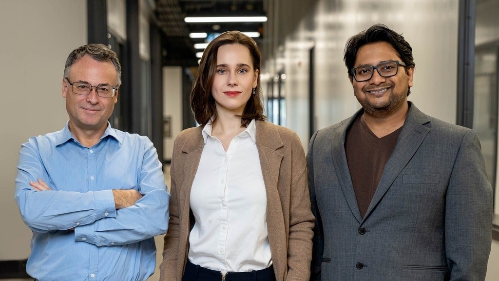 People people posing in a hallway. l-r Thomas Jennewein, Alex Maierean and Shihan Sajeed