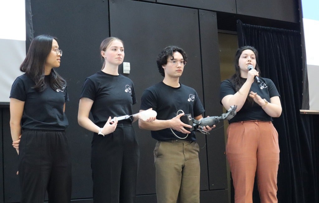 The Saturn team presenting their project on stage at the Norman Esch Entrepreneurship Awards for Capstone Design