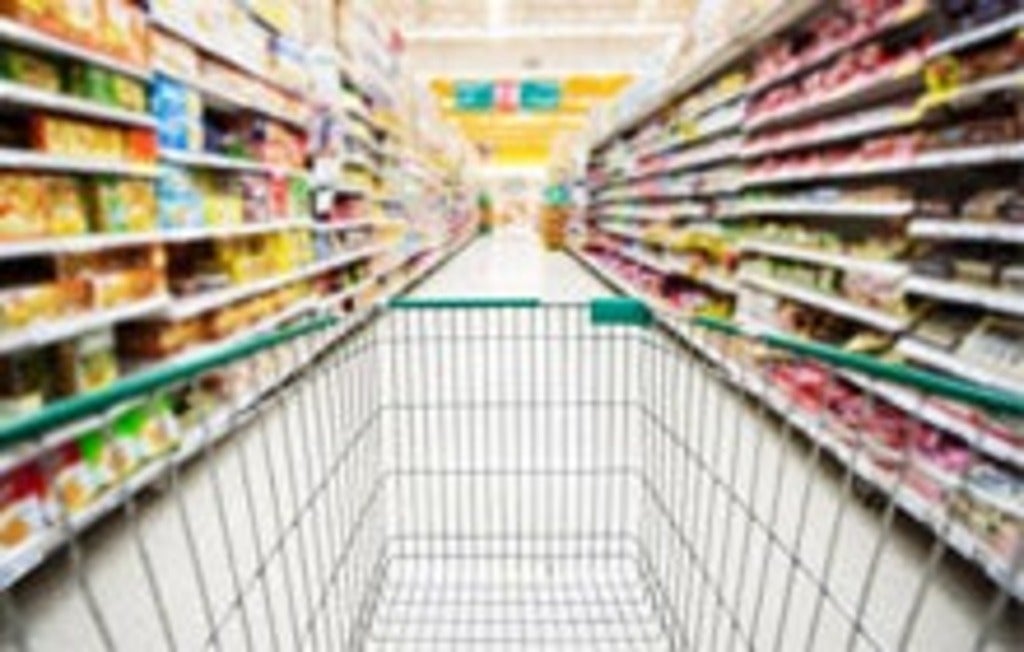 Shopping cart in grocery aisle