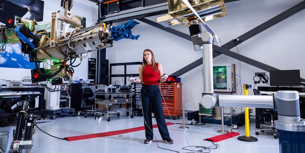 Mary McPhee testing part of the Canadarm2 robotic arm