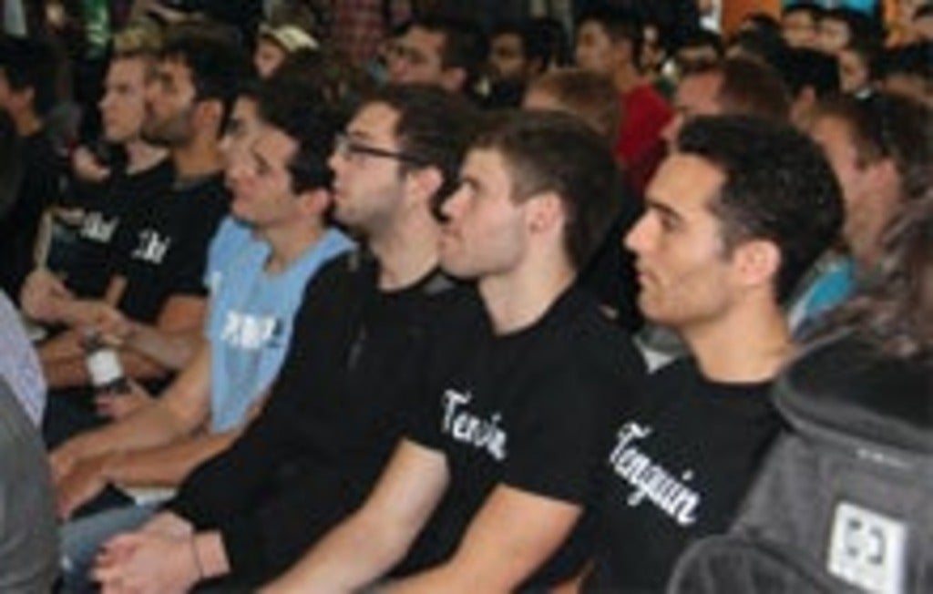 Entrepreneurs listen to volunteer speaker at VeloCity Garage