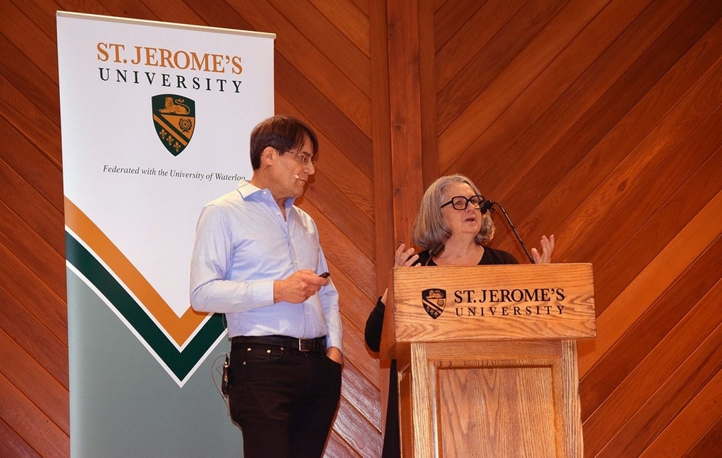 Joe and Stephanie Mancini standing at a podium