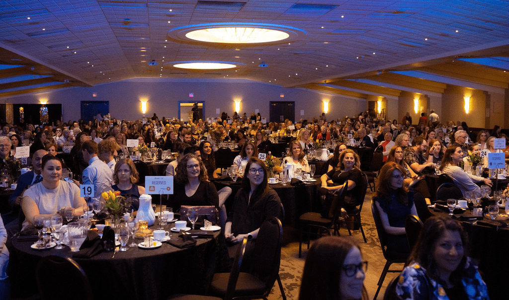 Attendees sitting at tables for the Women of the Year awards