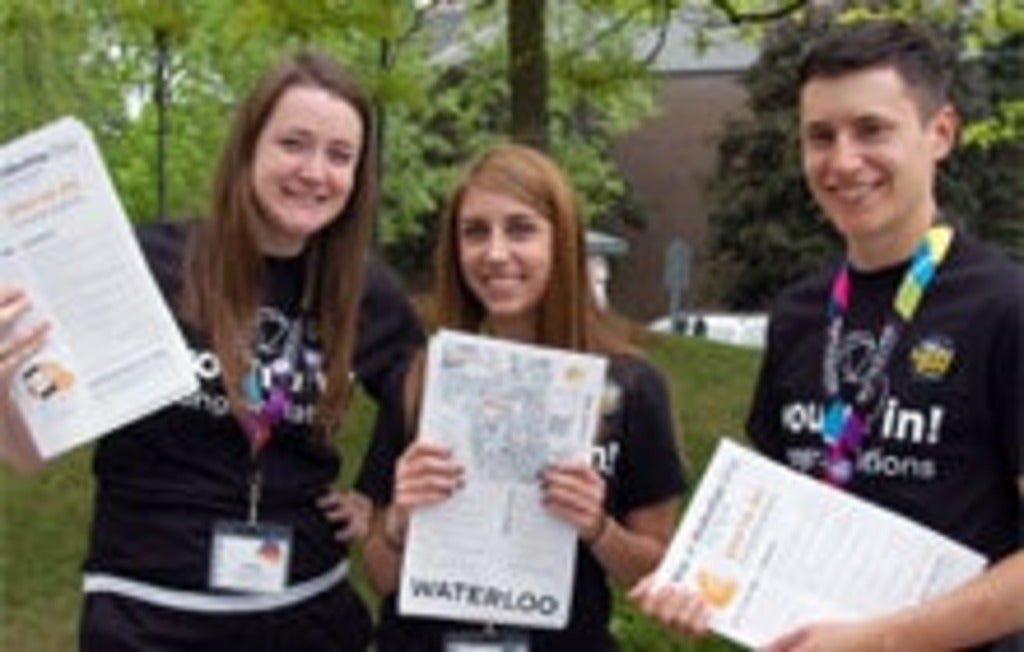 Future students holding their letters of acceptance