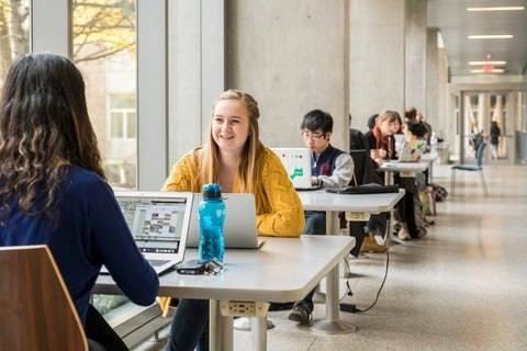 Students sitting in a lounge area
