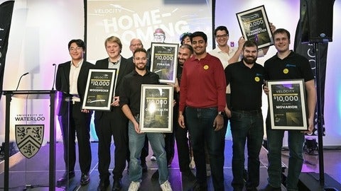2025 Momentum Grant winners pose for group photo on stage at Velocity Homecoming