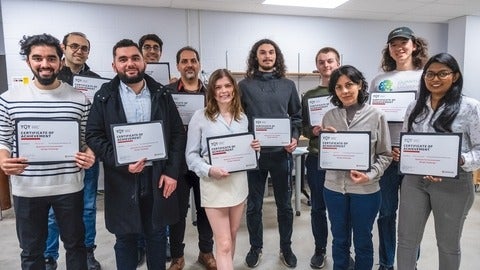 Waterloo graduate students and postdoctoral fellows accept their awards for Quantum for Environment Design Challenge