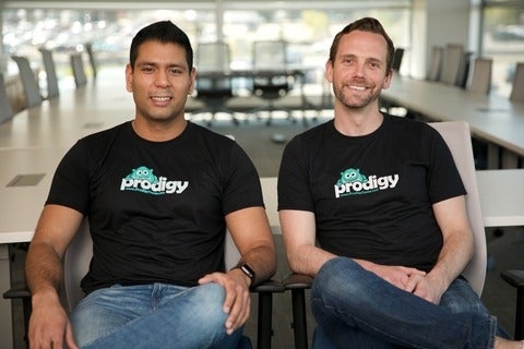 Rohan Mahimker (BASc ’11) and Alexander Peters (BASc ’11) sitting together and wearing Prodigy t-shirts