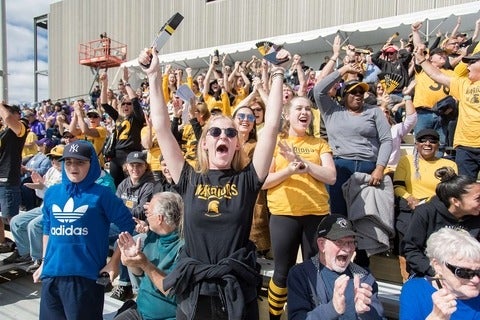 students watching football
