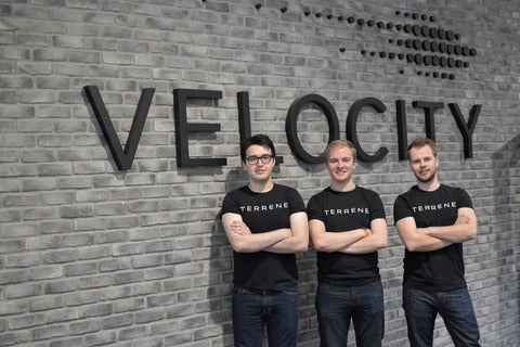Cam and colleagues by the Velocity sign