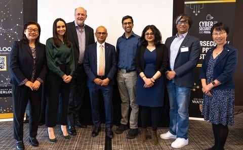 A group of 8 researchers posing for a picture