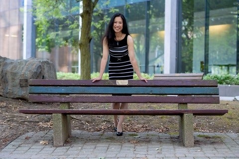 Anita Layton standing behind a bench