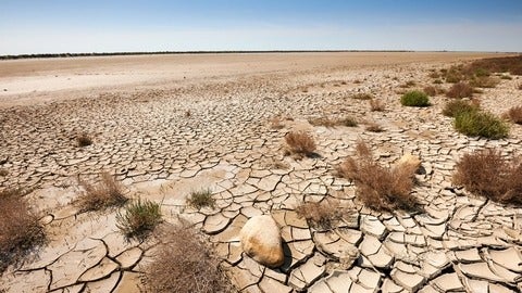 Arid climate and dry cracked soil in a desert in Kenya. 