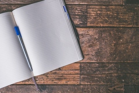 an open notebook and pen