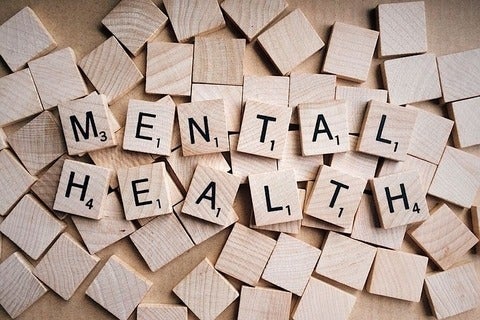 Scrabble tiles spell out mental health