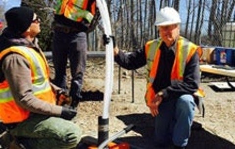 Professor John Cherry working in the field