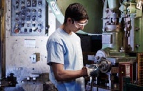 Student working with machinery