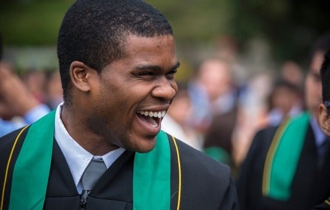 male student smiling at convocation