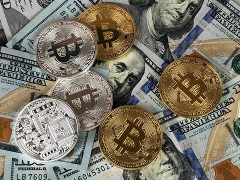 Crytpo coins and US paper money.