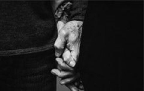 Senior couple holding hands