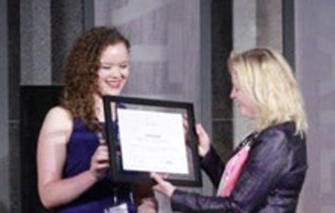 Madelaine Liddy receiving her award